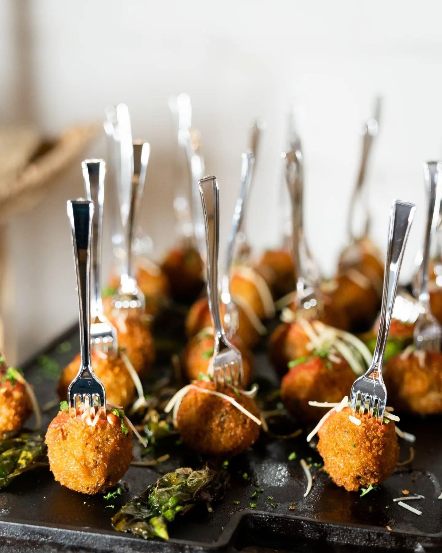 Crispy bites with marinara and parmesan served on mini forks
